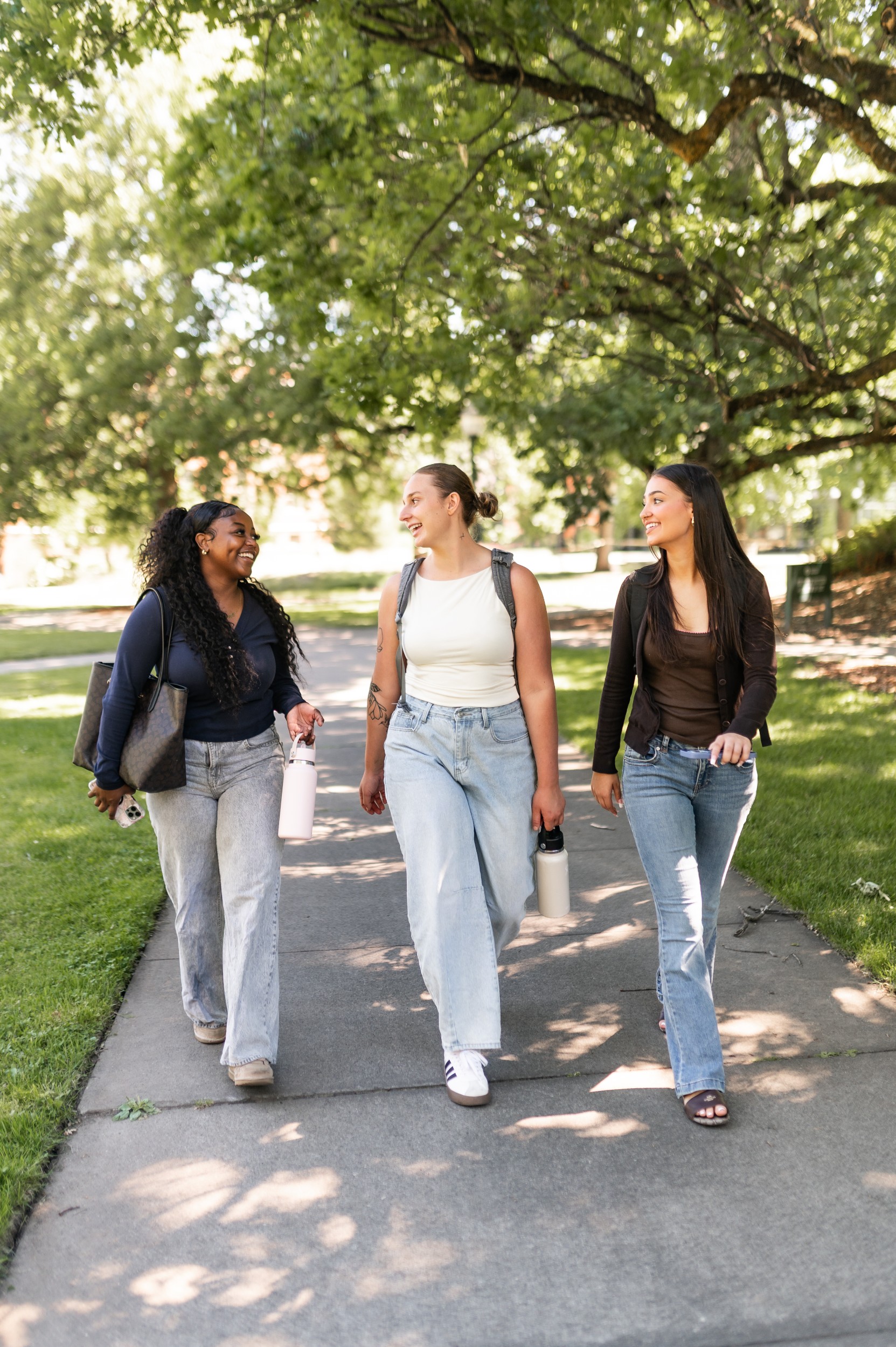 Three friends walking to class at University of Oregon