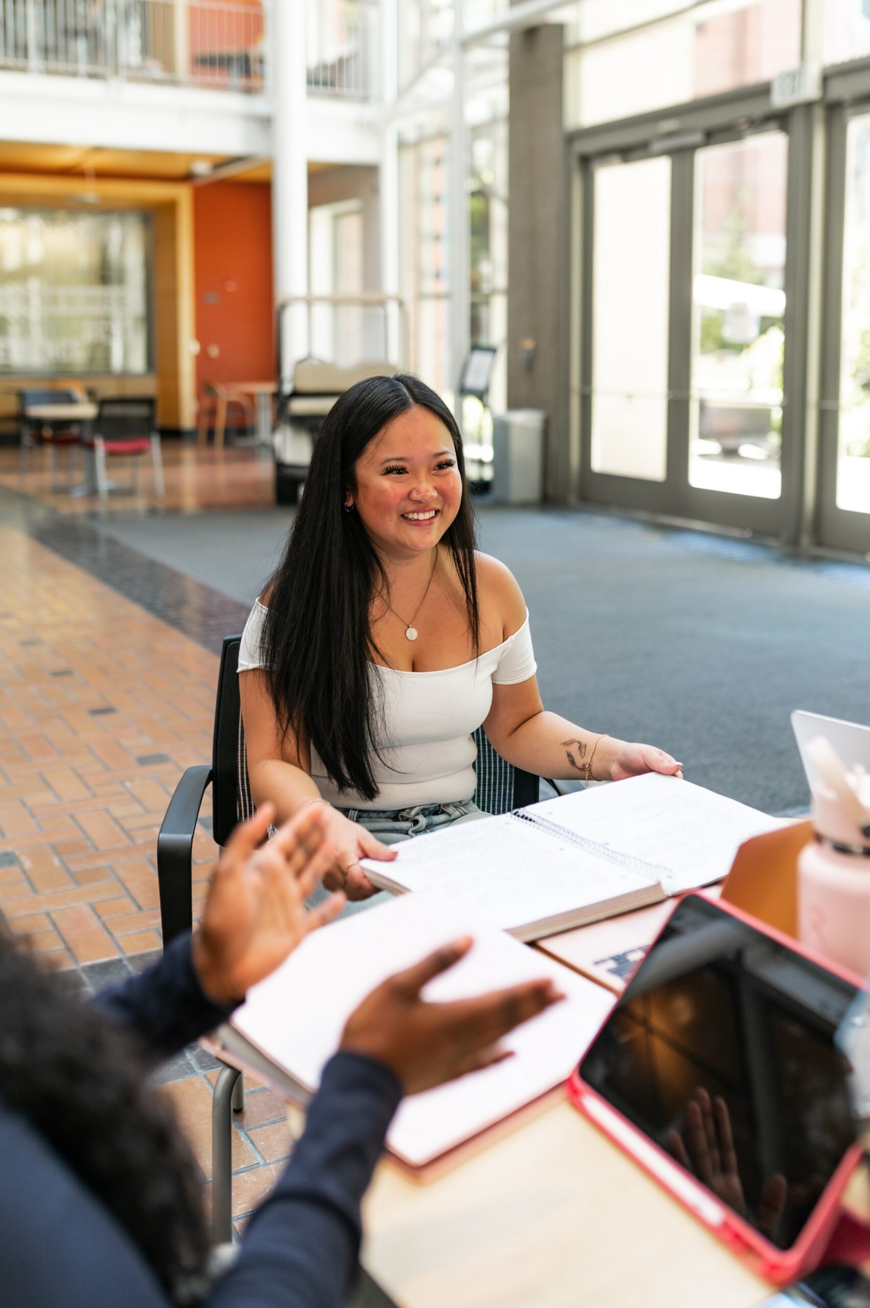 Young woman studying in the Lillis Business Complex
