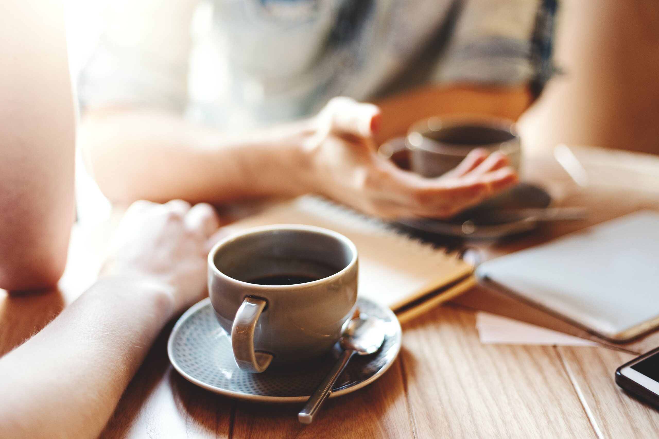 people discussing ideas over coffee scaled