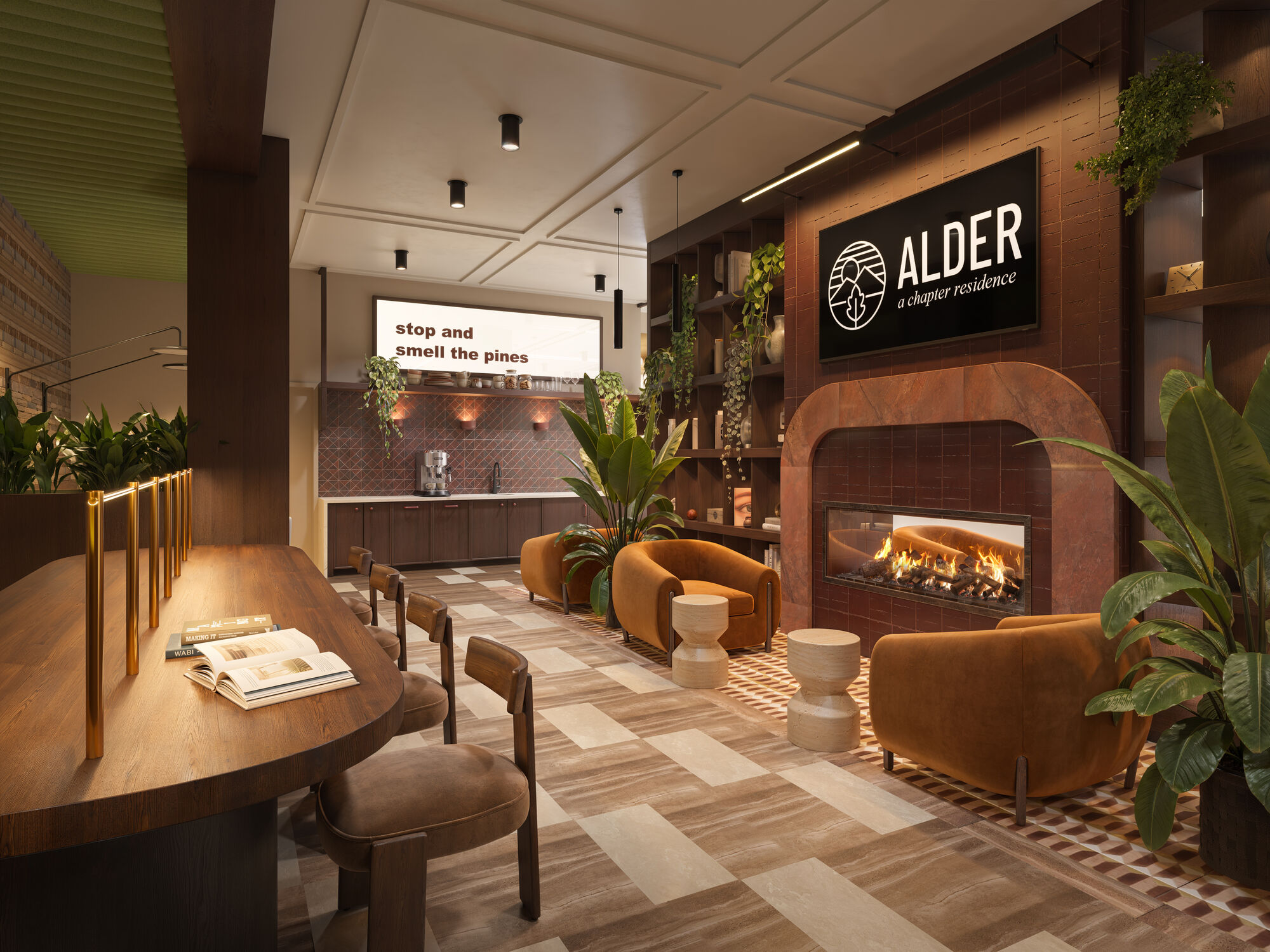 Resident library lounge with study table fireplace and coffee bar at Chapter Alder apartments